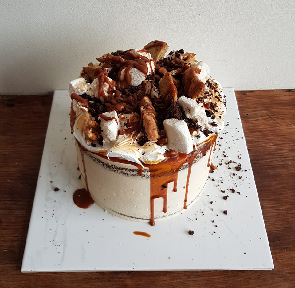 Drip Cake With Meringue, Macarons And Donuts