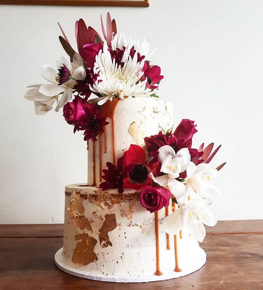 2 tier red and white floral cake
