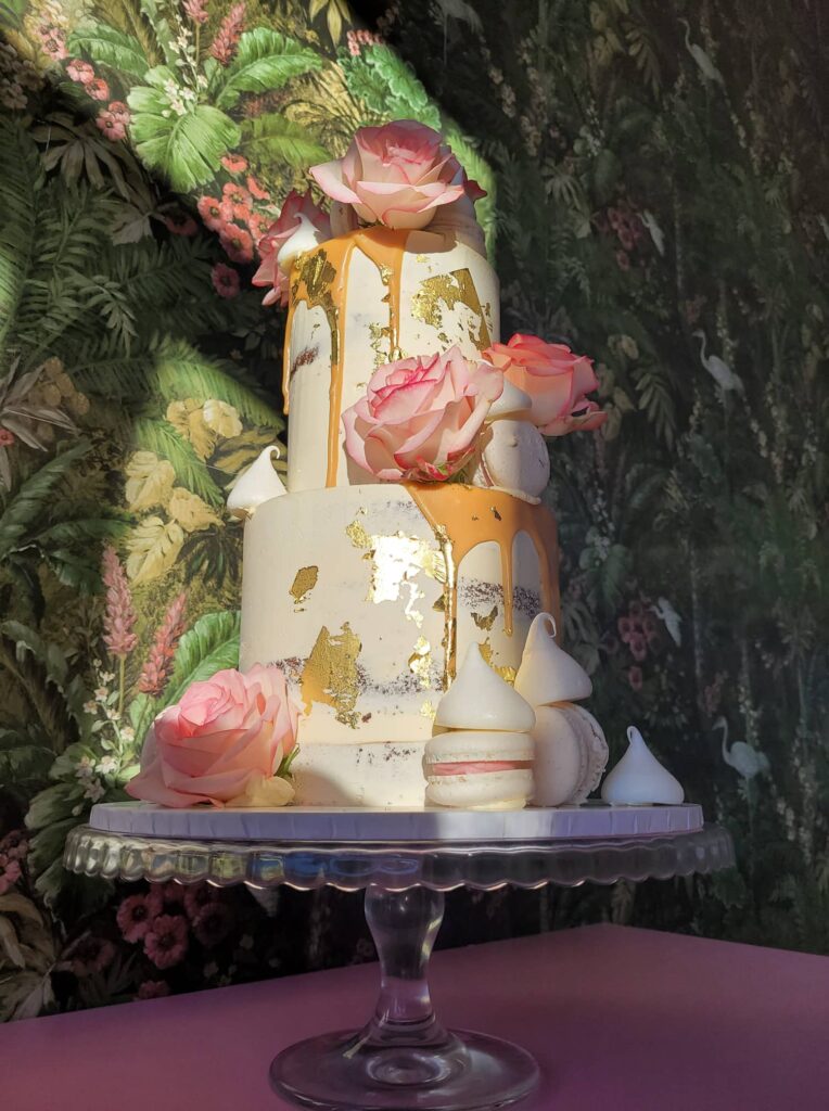 Two tier birthday cake with a semi naked finish, caramel drip, roses and macarons, The Cake Eating Co, Christchurch